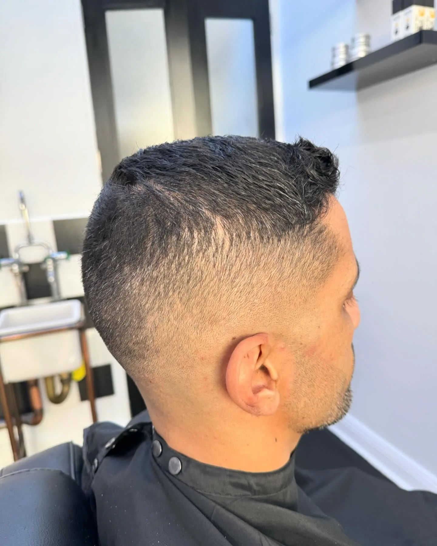 Short textured crop with high skin fade, side profile
